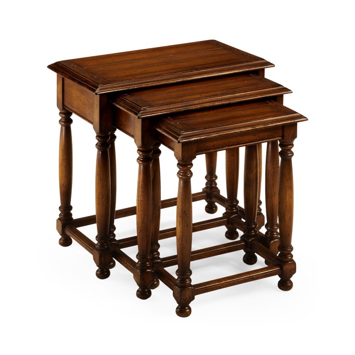Nest of three walnut tables with plank tops