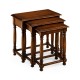 Nest of three walnut tables with plank tops