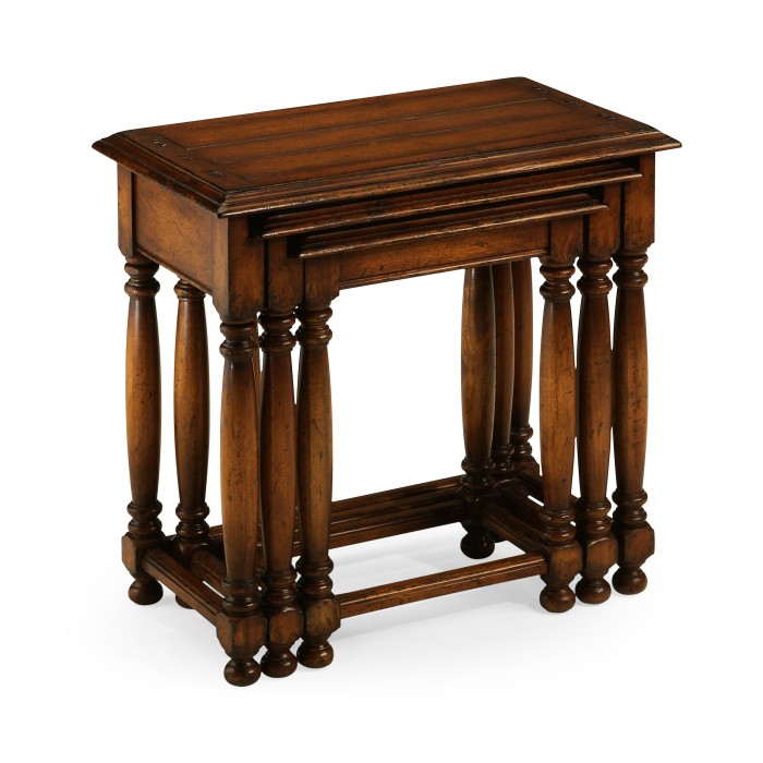 Nest of three walnut tables with plank tops