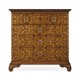 Walnut raised arabesques chest of drawers