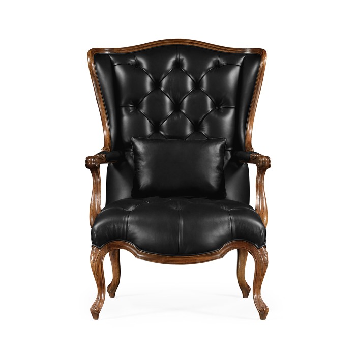 Wing-backed chair in black leather