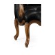 Wing-backed chair in black leather