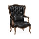 Wing-backed chair in black leather