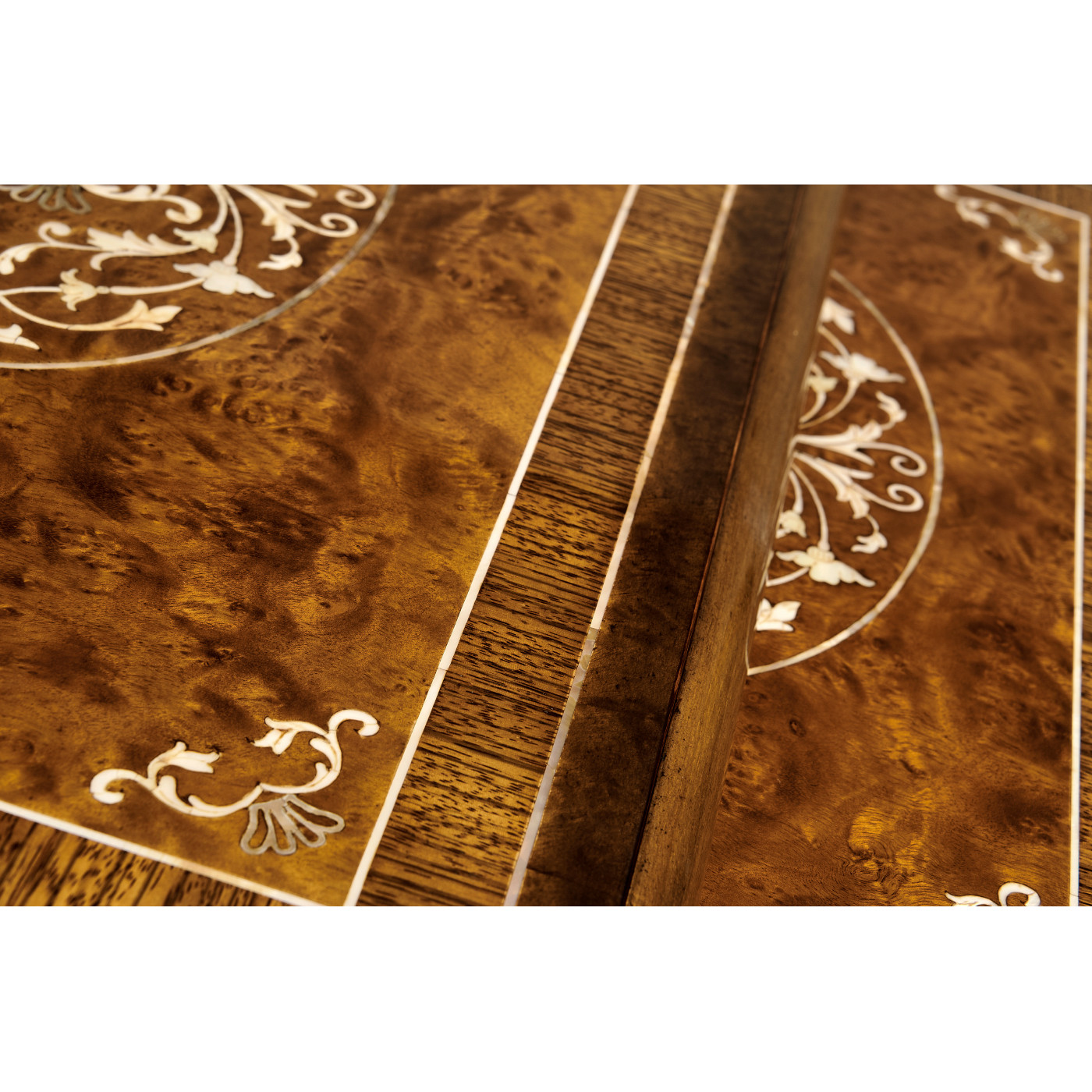 Burl and mother of pearl inlaid nest of two tables with carved legs